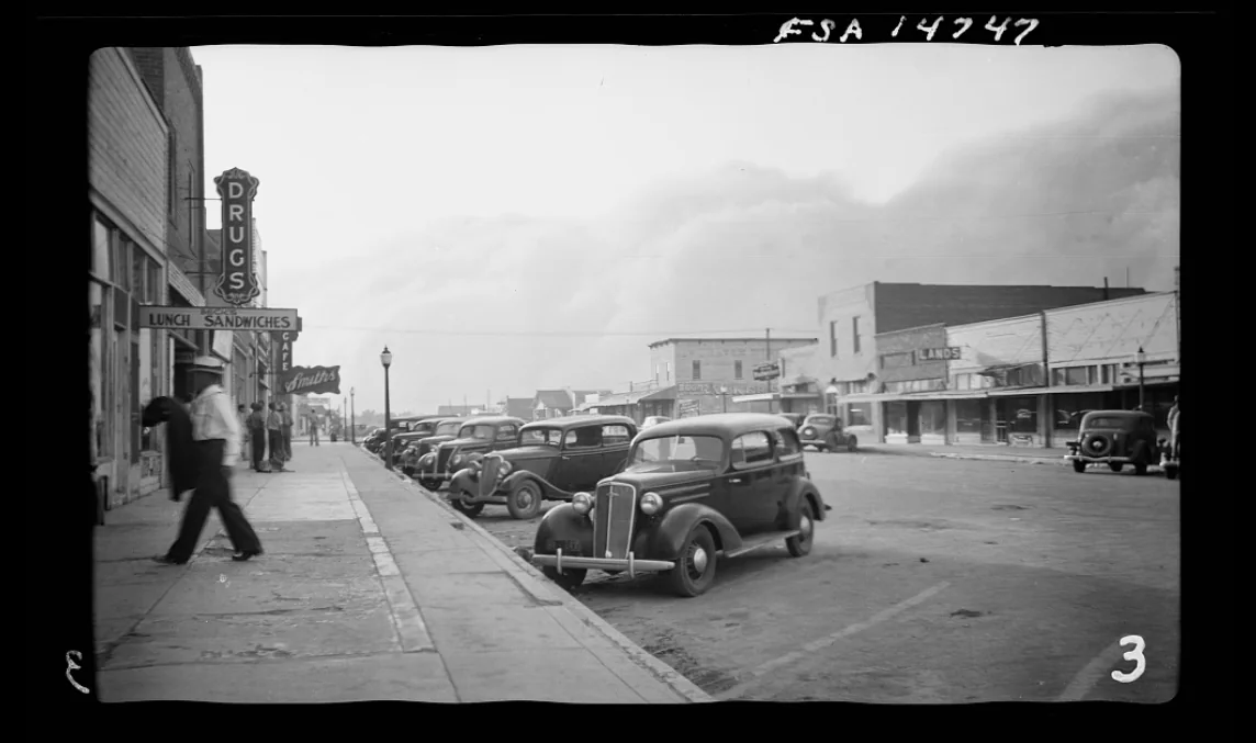 Historic black-and-white street scene in Elkhart, Kansas, from the Hurry Back research collection